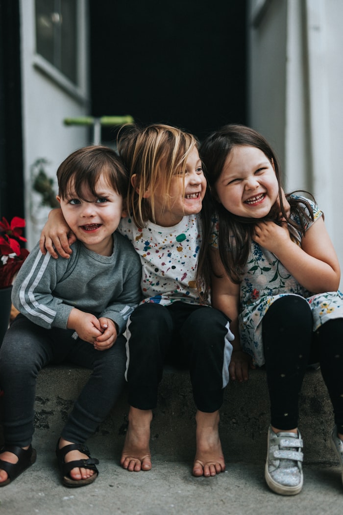 Children smiling together before a family activity